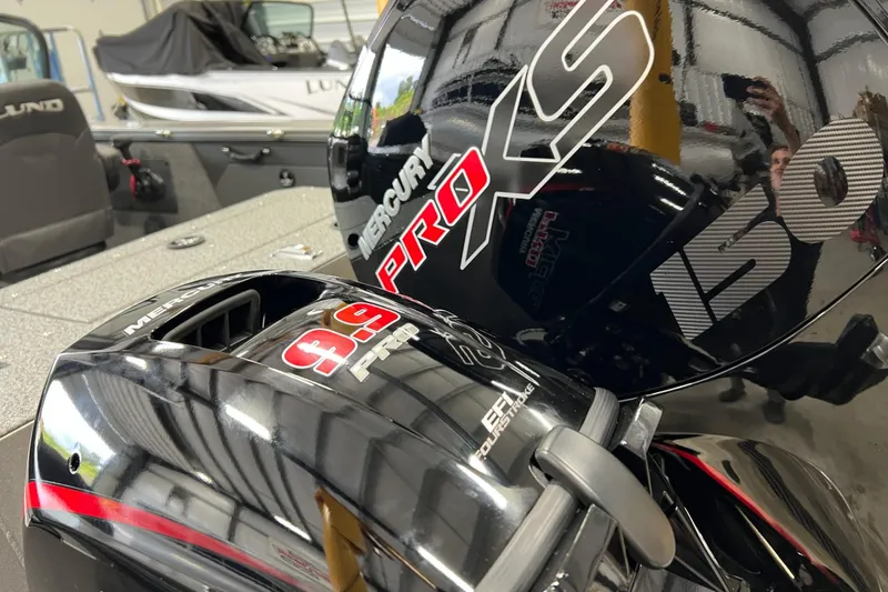 Slide: The Image of 2026 Lund 1875 Fisherman boat with Mercury Pro XS outboard engines in showroom. - 5