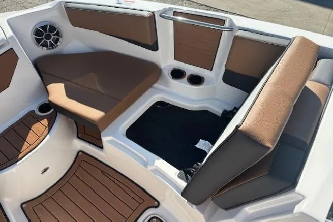 Slide: The Image of Interior of 2026 Yamaha Boats 222SE, featuring brown seating and modern design elements. - 10