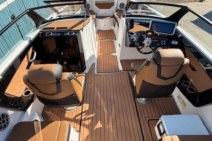 Slide: The Image of 2026 Yamaha Boats 222SE interior with luxurious seating and modern dashboard design. - 11