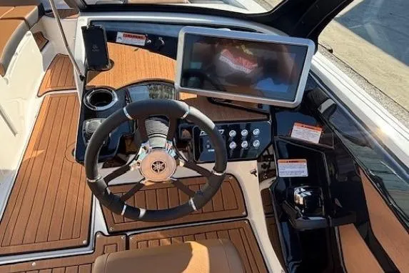 Slide: The Image of 2026 Yamaha Boats 222SE dashboard with steering wheel and touchscreen display. - 17