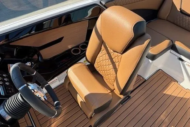Slide: The Image of 2026 Yamaha Boats 222SE interior with tan leather seating and modern steering wheel. - 19