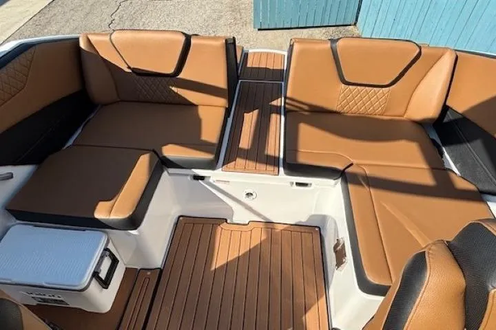 Slide: The Image of 2026 Yamaha Boats 222SE interior with tan leather seating and wood accents. - 21