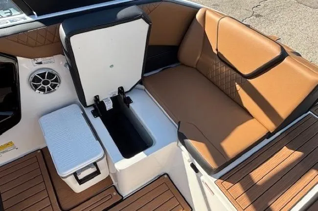 Slide: The Image of 2026 Yamaha Boats 222SE interior with tan seating and storage compartments. - 22