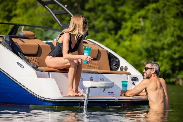 Slide: The Image of Couple enjoying leisure time on 2026 Yamaha Boats 222SE, relaxing by the water. - 27