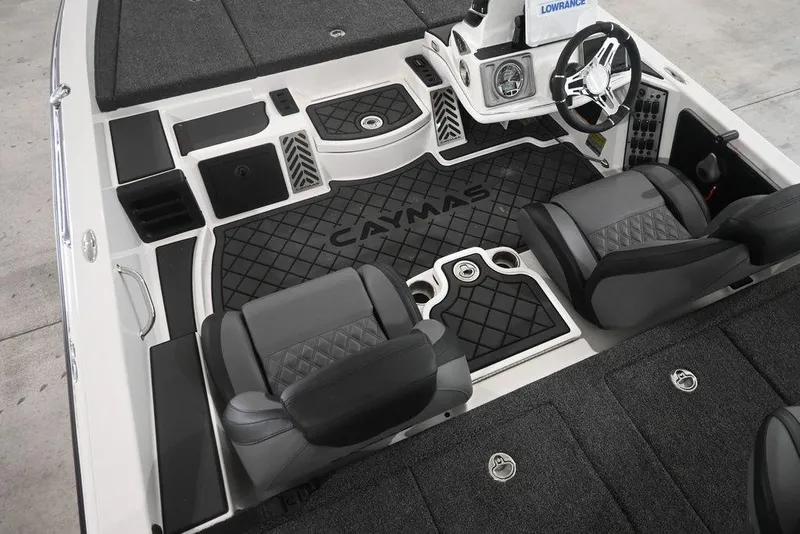 Slide: The Image of 2026 Caymas CX19 PRO boat interior with sleek seating and modern dashboard design. - 4
