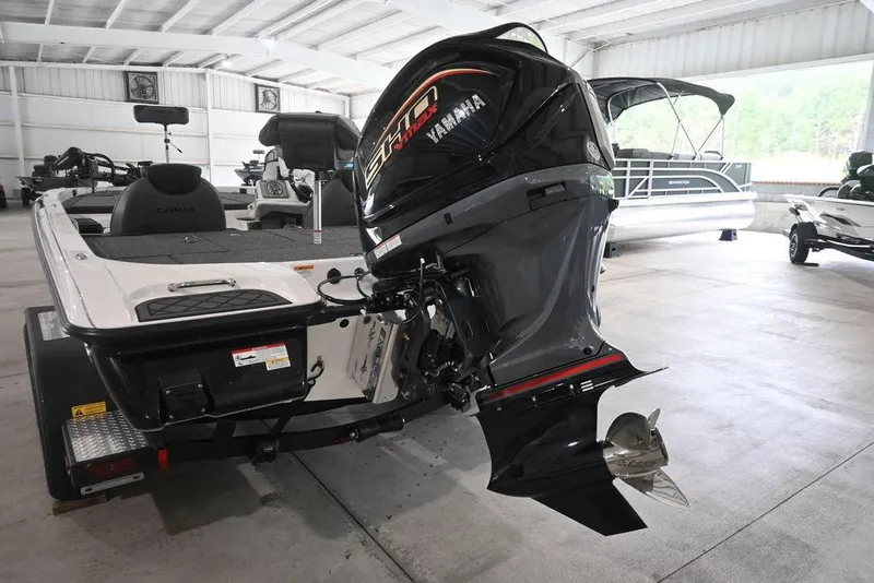 Slide: The Image of 2026 Caymas CX19 PRO boat with Yamaha engine in a showroom. - 5