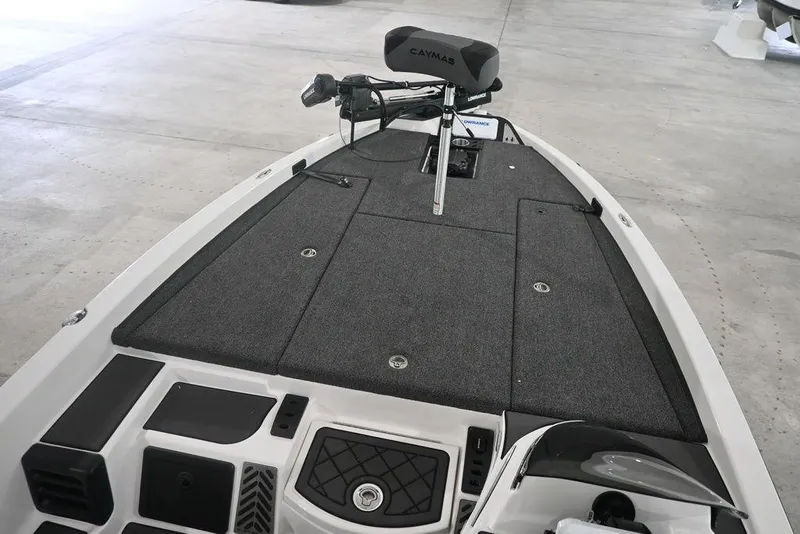 Slide: The Image of 2026 Caymas CX19 PRO boat deck with trolling motor and storage compartments. - 7