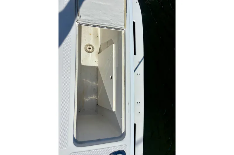 Slide: The Image of Open storage compartment on 2002 Luhrs 32 Open boat deck. - 17
