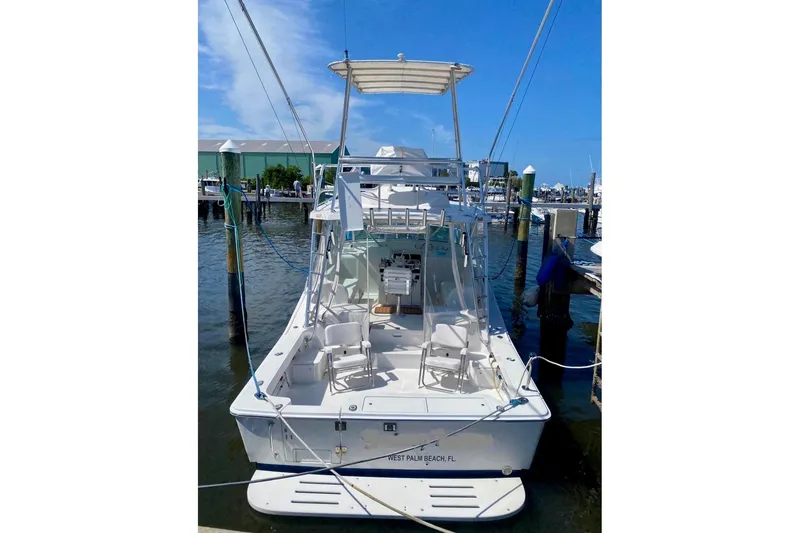Slide: The Image of 2002 Luhrs 32 Open boat docked in West Palm Beach marina. - 2