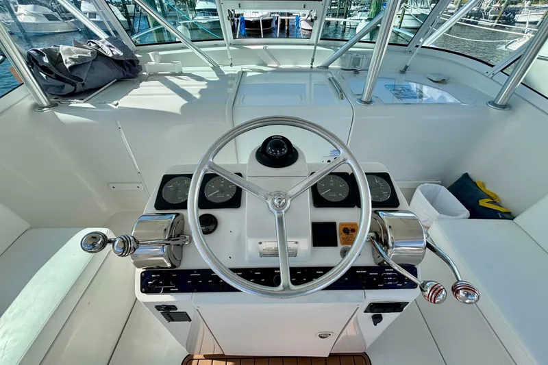 Slide: The Image of Helm of 2002 Luhrs 32 Open boat with steering wheel and controls. - 20