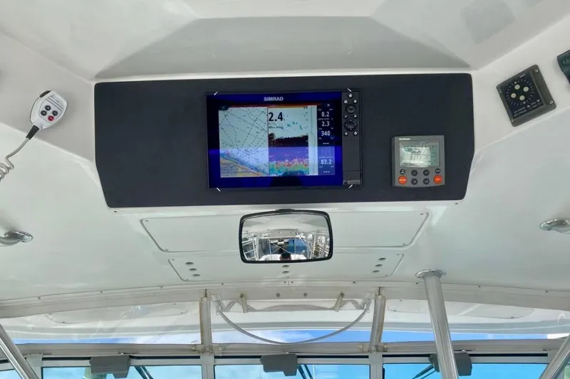 Slide: The Image of Control panel of a 2002 Luhrs 32 Open boat with navigation equipment. - 25
