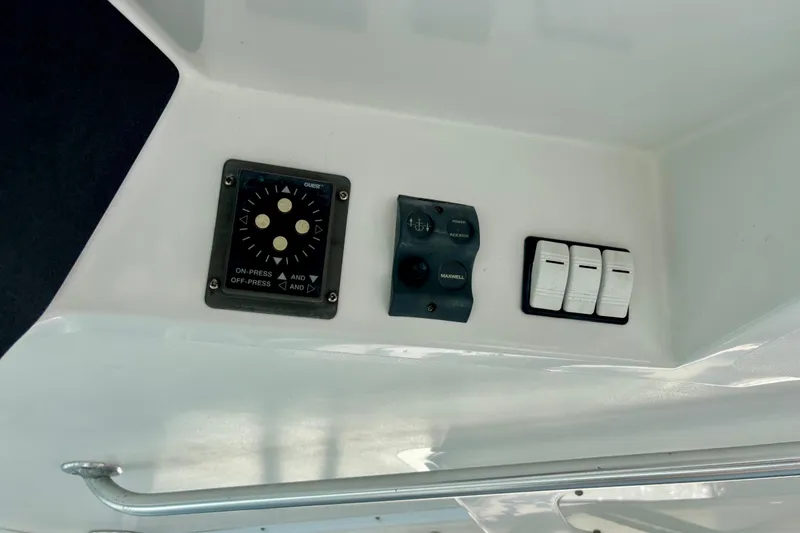 Slide: The Image of Control panel on 2002 Luhrs 32 Open boat with switches and dials. - 26