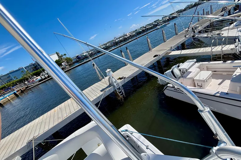 Slide: The Image of Docked 2002 Luhrs 32 Open boat with clear blue sky and marina view. - 37