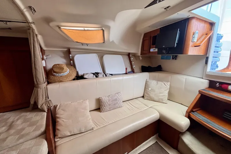 Slide: The Image of Interior of 2002 Luhrs 32 Open boat with beige seating and wooden accents. - 41