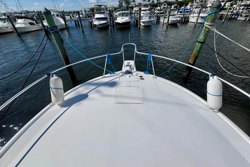 Slide: The Image of Bow view of 2002 Luhrs 32 Open yacht docked at marina. - 5