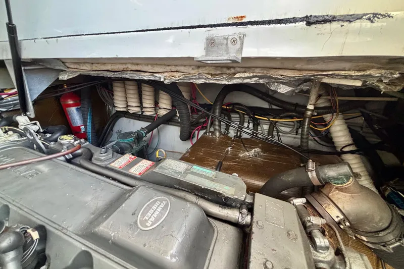 Slide: The Image of Engine compartment of a 2002 Luhrs 32 Open boat, showcasing mechanical components. - 50