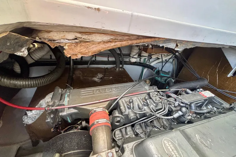 Slide: The Image of Engine compartment of a 2002 Luhrs 32 Open boat, showing detailed mechanical components. - 51