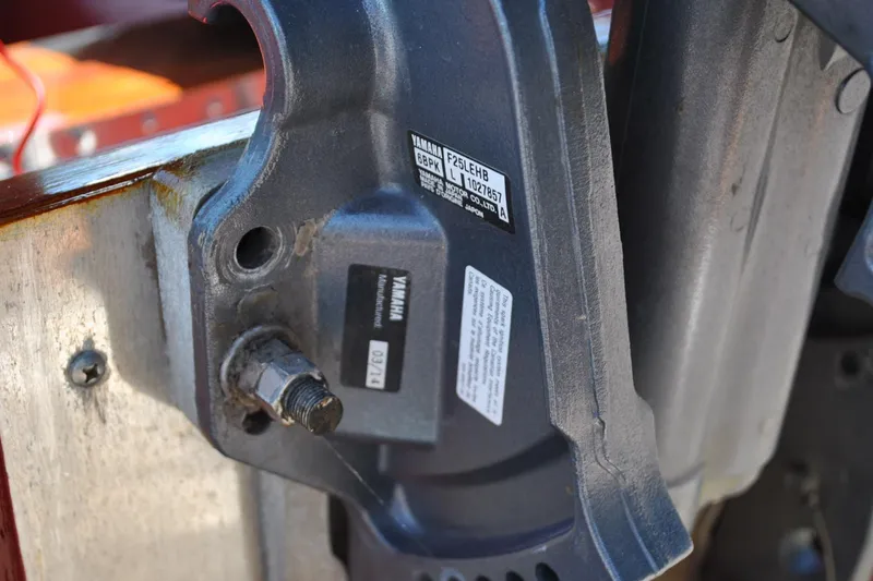 Slide: The Image of Close-up of a Yamaha engine part with visible labels and bolts, Custom Underwood 2014 model. - 11