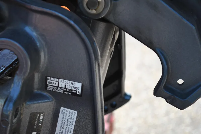 Slide: The Image of Close-up of Yamaha motor part with model and serial number labels. - 12