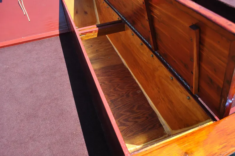 Slide: The Image of Open wooden storage compartment in a custom Underwood model, 2014, with red and brown finish. - 16