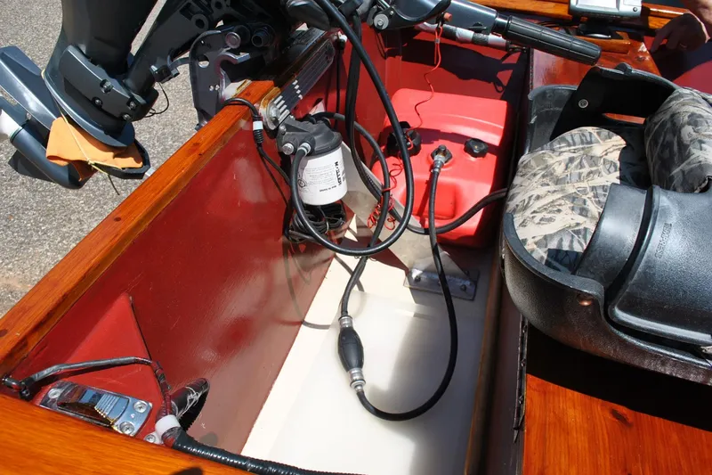 Slide: The Image of Interior of a 2014 Custom Underwood boat showing motor and seating area. - 17