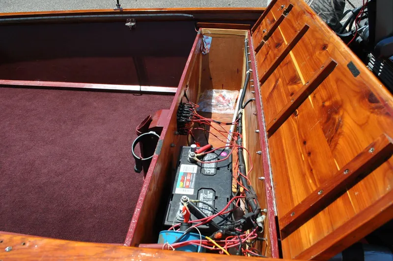 Slide: The Image of Wooden boat interior with battery compartment, wiring, and maroon carpet, Custom Underwood model, 2014. - 20
