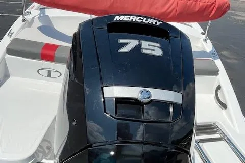 Slide: The Image of 2022 Tahoe T6 boat with Mercury 75 engine, featuring sleek design and red accents. - 10