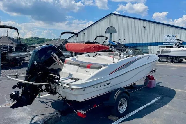 Slide: The Image of 2022 Tahoe T6 boat with Mercury engine on trailer, parked outdoors. - 3