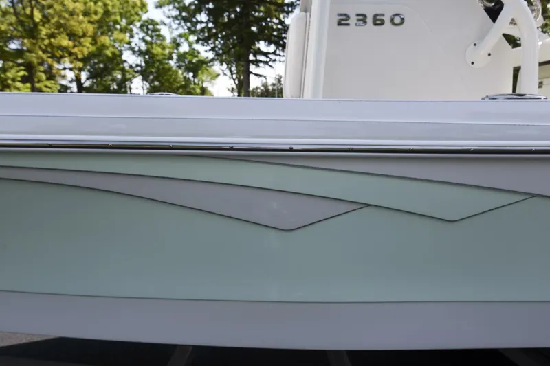 Slide: The Image of 2022 Ranger 2360 Bay boat with sleek design and modern detailing. - 11