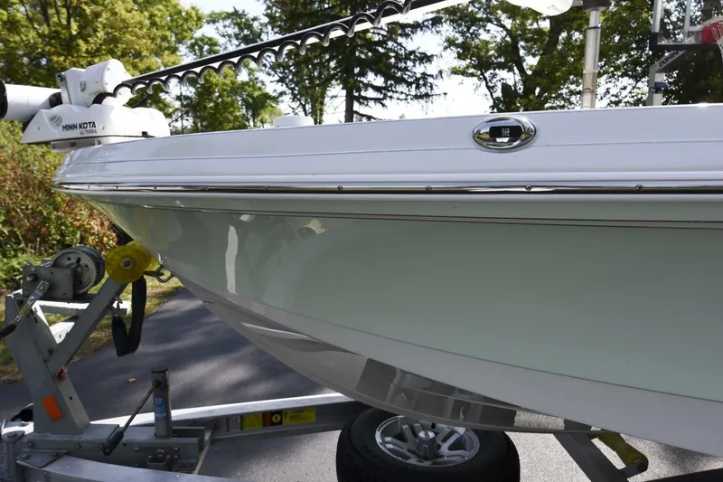 Slide: The Image of 2022 Ranger 2360 Bay boat on trailer, featuring Minn Kota trolling motor. - 20