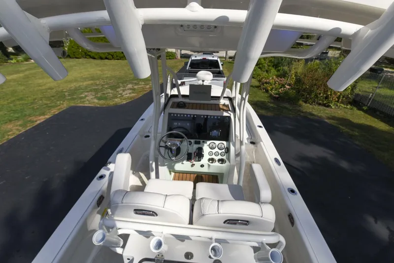Slide: The Image of 2022 Ranger 2360 Bay boat interior with steering console and seating. - 24