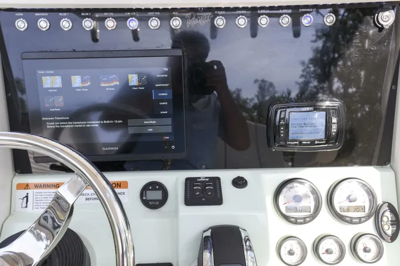 Slide: The Image of Control panel of 2022 Ranger 2360 Bay boat with Garmin display and gauges. - 31