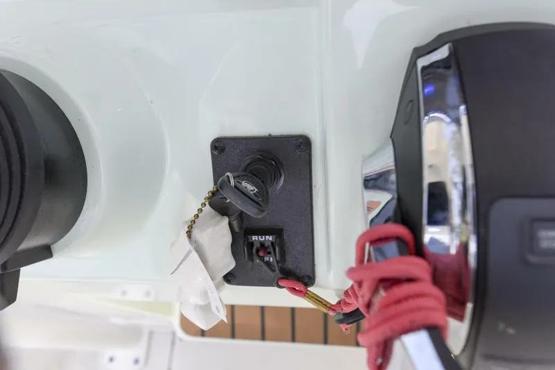 Slide: The Image of Key ignition switch on 2022 Ranger 2360 Bay boat dashboard. - 32