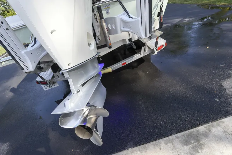 Slide: The Image of Rear view of 2022 Ranger 2360 Bay boat on a trailer, showing propeller and motor. - 42