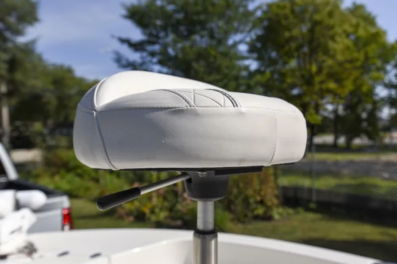 Slide: The Image of White seat on 2022 Ranger 2360 Bay boat, outdoor setting. - 56