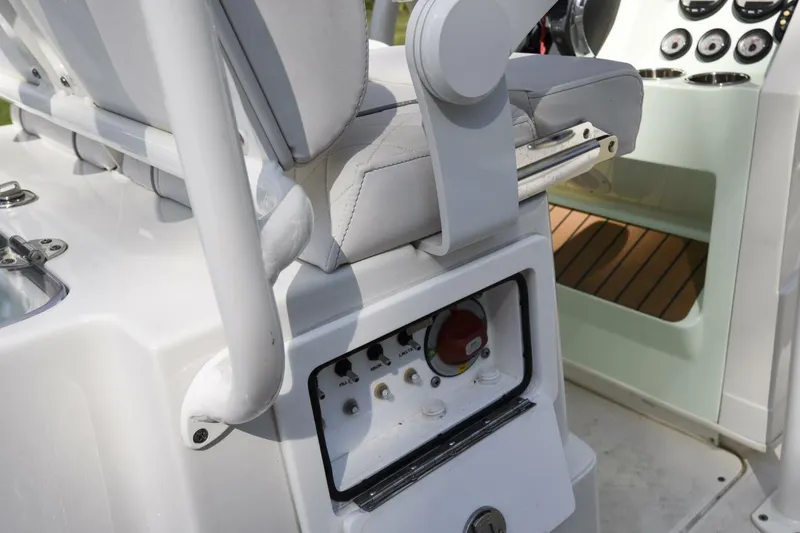Slide: The Image of 2022 Ranger 2360 Bay boat console with controls and seating detail. - 61