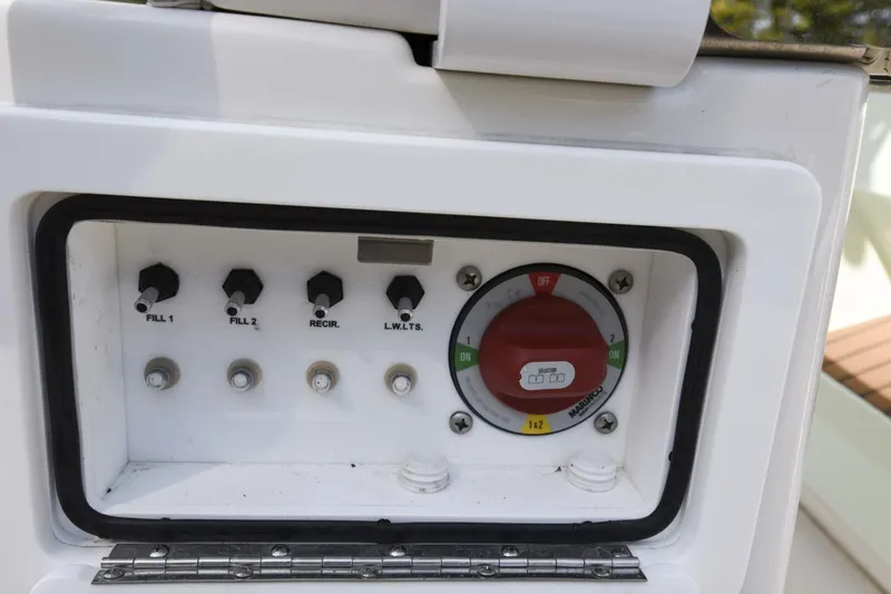 Slide: The Image of Control panel of 2022 Ranger 2360 Bay boat with switches and dial. - 62