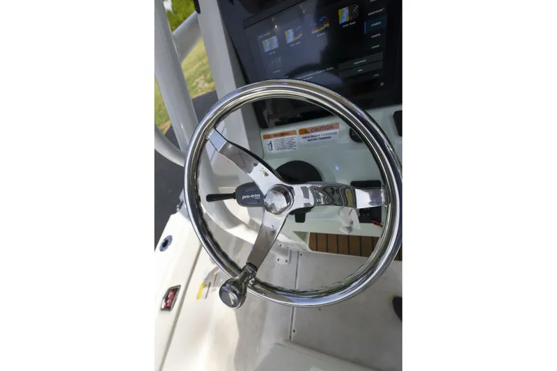 Slide: The Image of Steering wheel of 2022 Ranger 2360 Bay boat with control panel. - 70