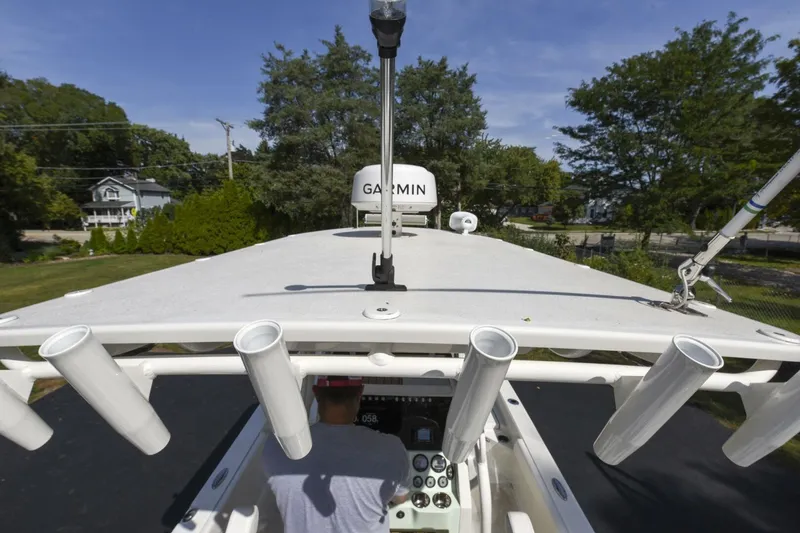 Slide: The Image of 2022 Ranger 2360 Bay boat with Garmin equipment, viewed from above, in a residential area. - 73