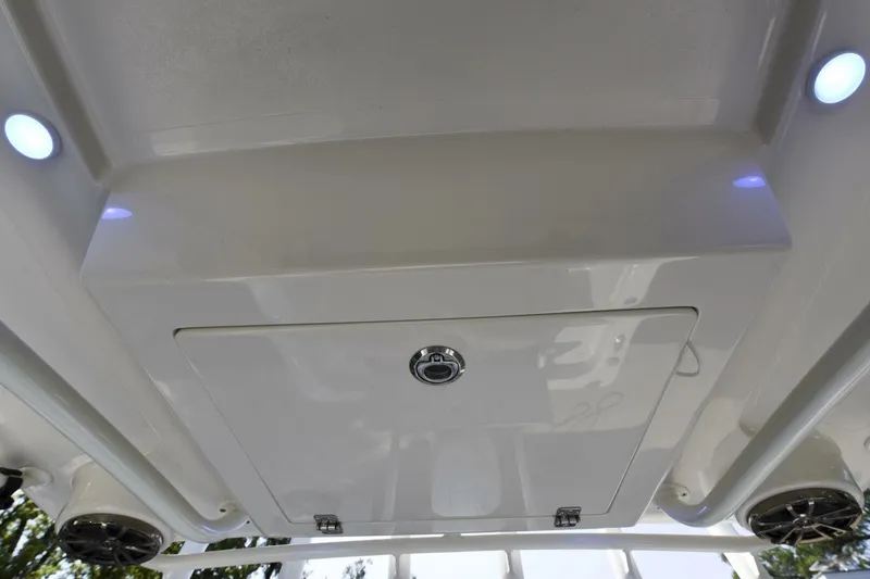 Slide: The Image of 2022 Ranger 2360 Bay boat ceiling with storage compartment and LED lights. - 74