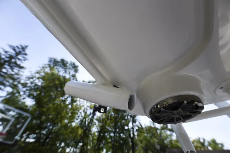 Slide: The Image of Close-up of 2022 Ranger 2360 Bay boat's speaker and rod holder under canopy. - 76