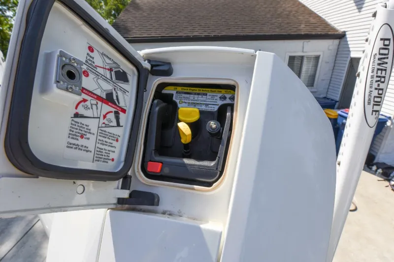 Slide: The Image of 2022 Ranger 2360 Bay boat engine compartment with instructions and Power-Pole anchor. - 79