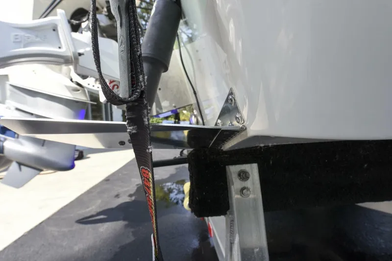 Slide: The Image of 2022 Ranger 2360 Bay boat detail showing motor mount and trailer components. - 83