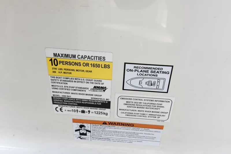 Slide: The Image of 2022 Ranger 2360 Bay capacity label, seating diagram, and safety warnings. - 96