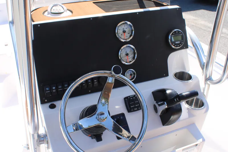 Slide: The Image of Steering console of 2026 Key West 189 FS boat with gauges and controls. - 14