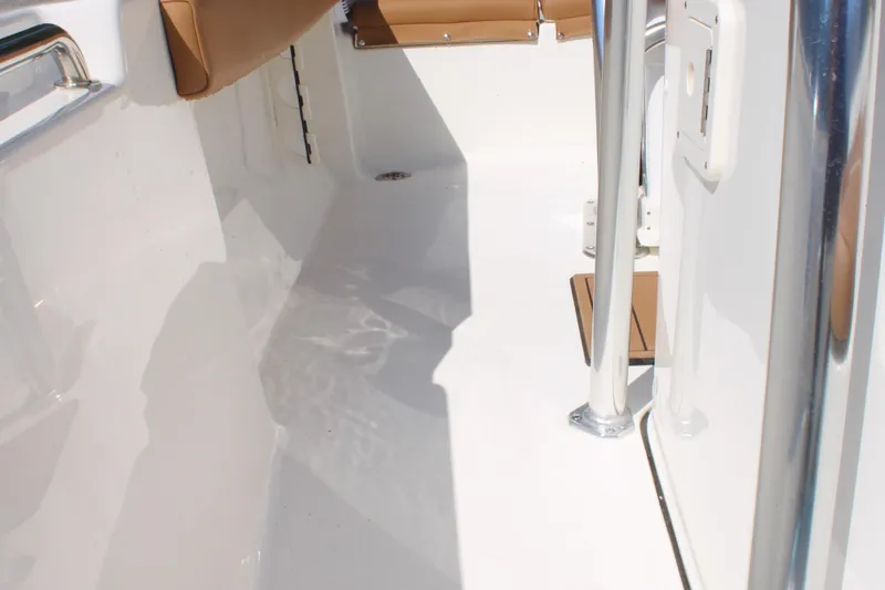 Slide: The Image of 2026 Key West 189 FS boat interior with sleek white finish and tan seating. - 20