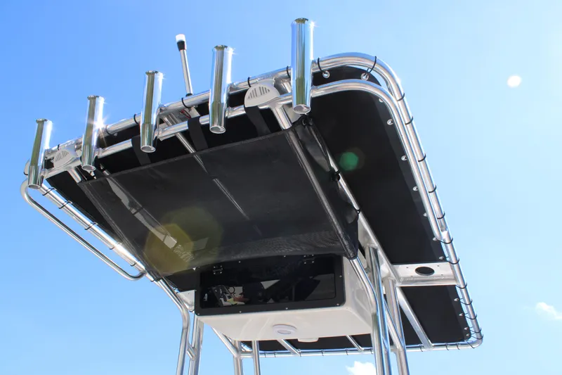 Slide: The Image of T-top of 2026 Key West 189 FS boat with rod holders against blue sky. - 25