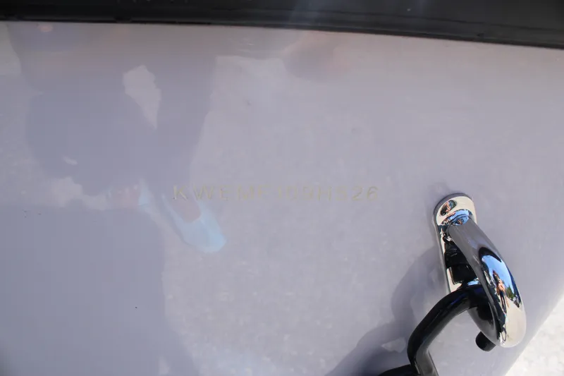 Slide: The Image of 2026 Key West 189 FS boat hull with chrome cleat and visible serial number. - 26