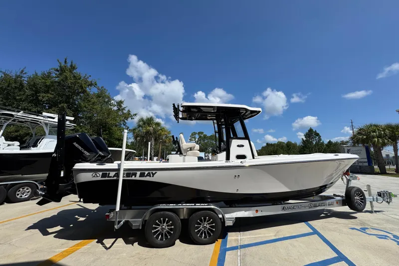 Slide: The Image of 2026 Blazer 2800 Makaira boat on trailer under clear blue sky. - 10