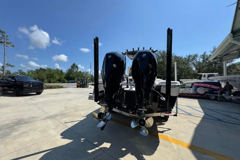 Slide: The Image of 2026 Blazer 2800 Makaira boat with dual outboard motors in a sunny outdoor setting. - 14